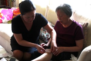 Mom gets her banged up leg bandaged.